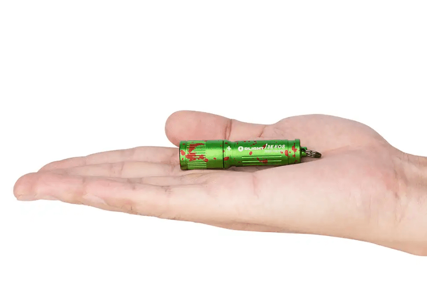 This photo shows a keychain flashlight resting in the palm of your hand.