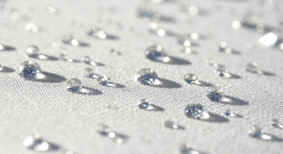 This image shows a water droplet blocked by a fabric surface.